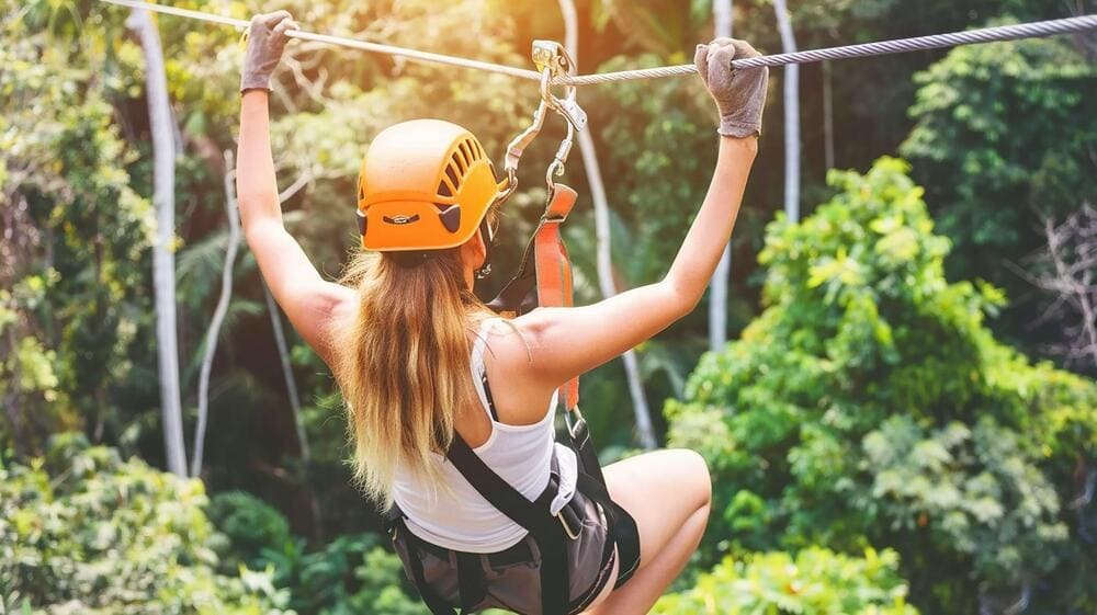 Feel the rush of wind and freedom as you zip through nature from above (Source: Freepik)